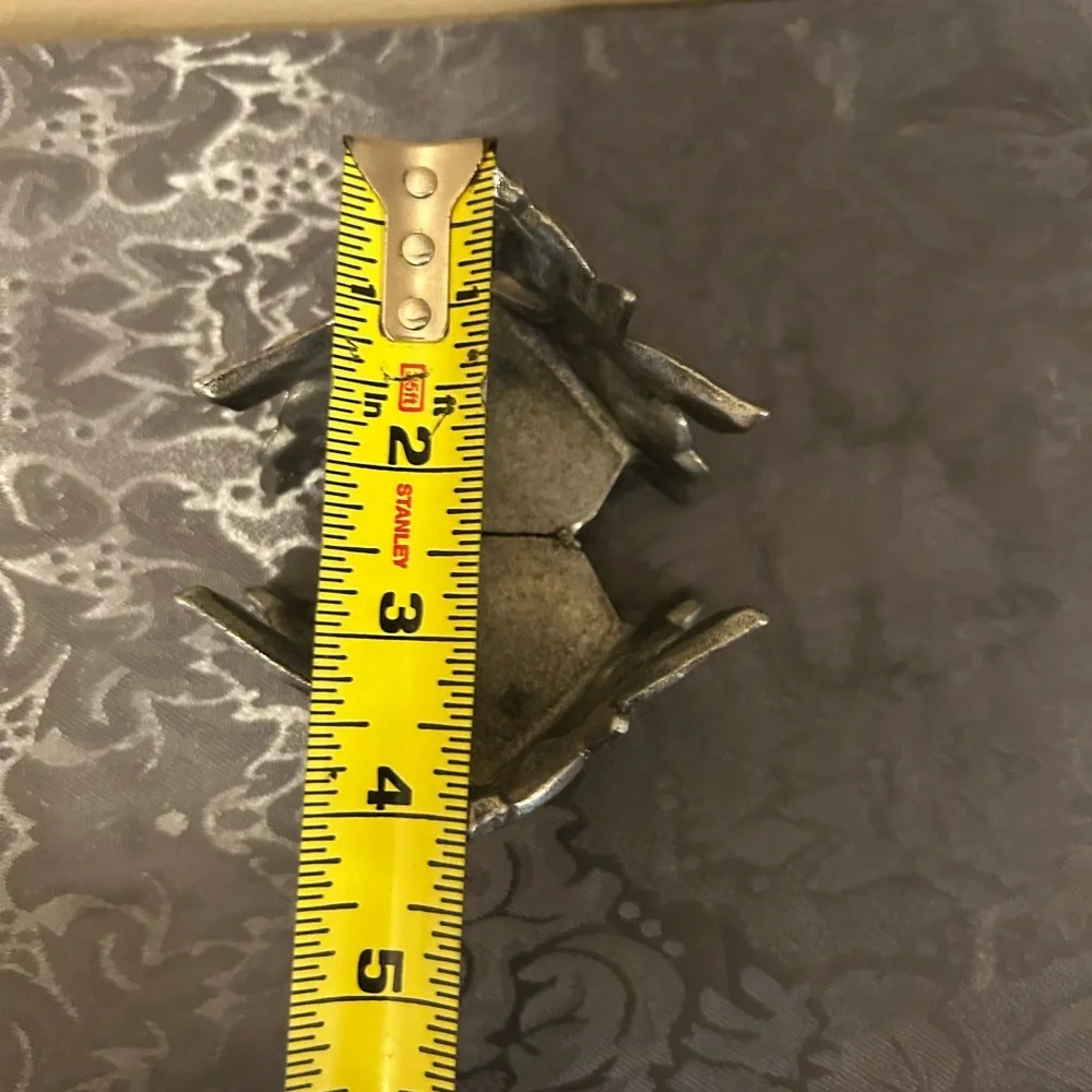 Pewter candle holder features hummingbirds and hearts